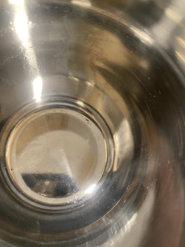 Hard to see rough scratches on bottom of cup .