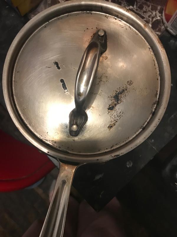 Raised black formations on lid