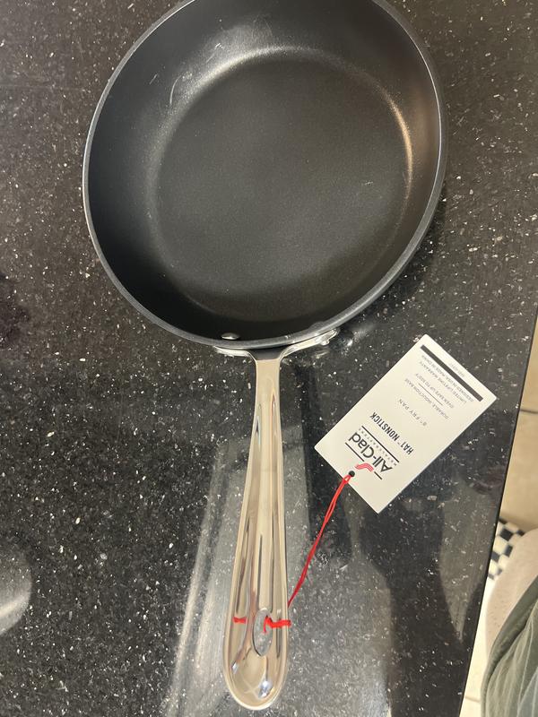 Scratches on the non stick and a gouge in the side.