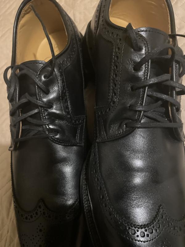 Customer photo for "Poor finish on upper part of shoes where laces are"