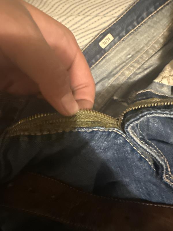 zippper was sown back shut