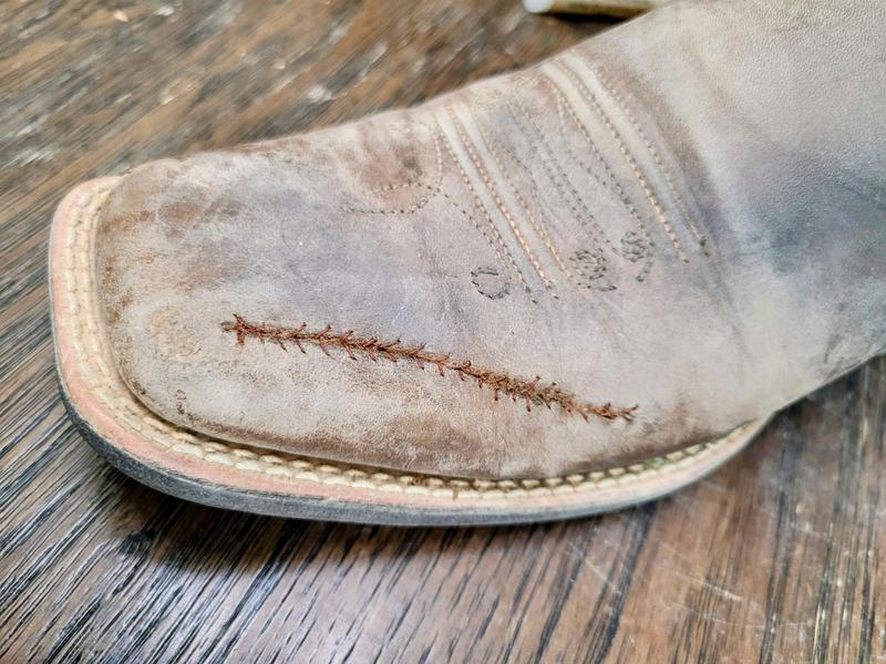 Repaired w/ baseball stich, but not optimistic it'll last