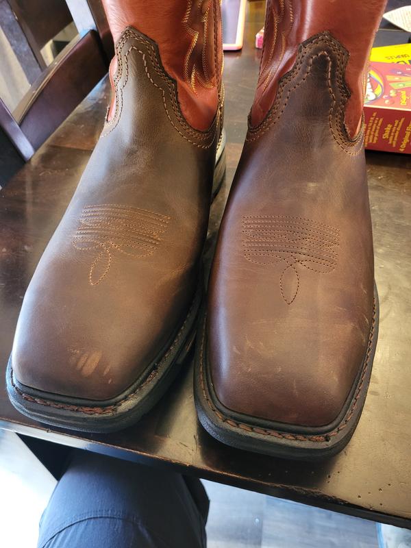 Both "new" pairs of boots with crease and scuff marks on them.