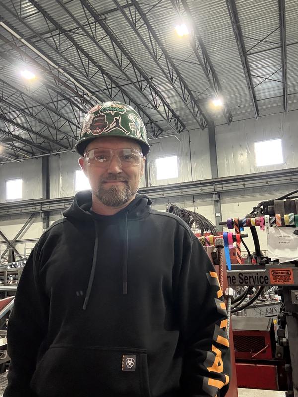 My fiancé Ricky at work with new Ariat pullover.