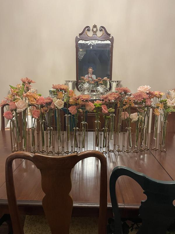 Easy centerpiece I used two matching test tube cases filled with fresh blooms from grocery store