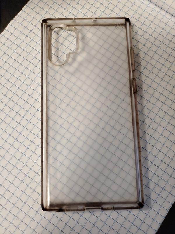 Back view of the case against grid paper. The stipple on the inside of the case and its tendency to scratch obviously blurs the grid lines.