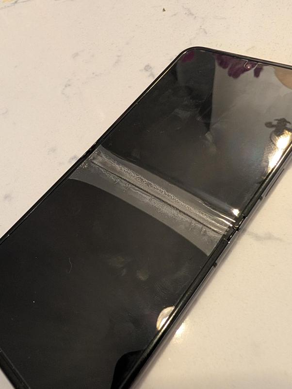 Screen surface separating from the phone in the middle.