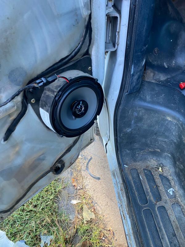 Installed using the frame of the factory speakers (what’s not torn up on the ground below).