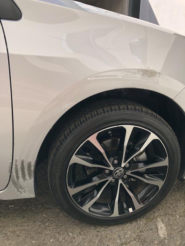 Snow tire chain damage to right fender