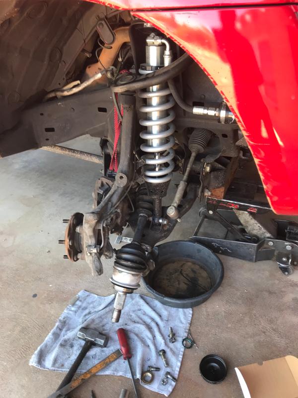 New Struts, New CV Axle, and New Wheel Bearing Assemblies. You can see 2 of the 4 bearing assembly bolts just behind the wheel lugs.