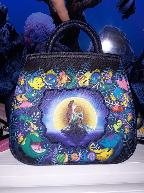 With a fish backpack Polochon DISNEY JEMINI The little mermaid 2
