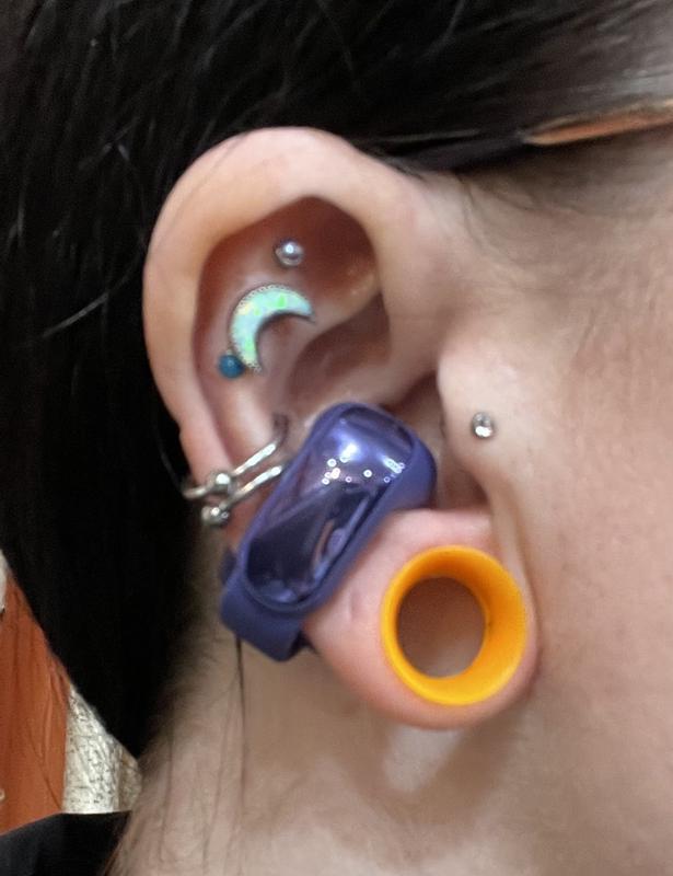 Open ear bud with conch piercings
