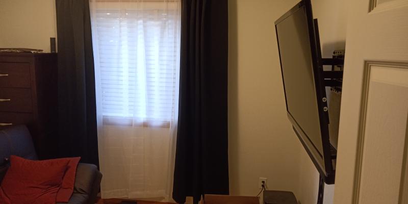 TV + Soundbar mounted with Surround sound speaker in frame