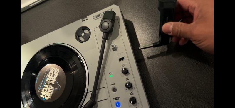 Plugging in the 1/4” Jack into the turntable.