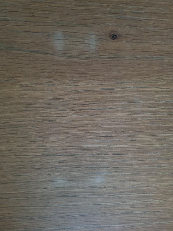 Marks on polished wood left by unit.