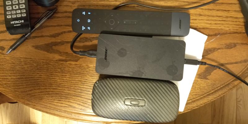 Bose Power block for speakers + bose remote and glasses case for scale.