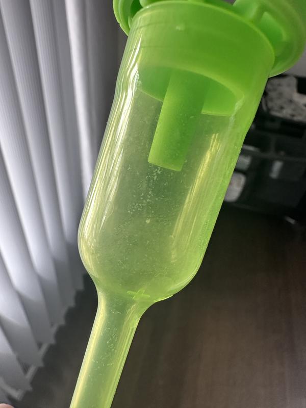 It has milk residue and yes I do take out the top part to load it in the washer.