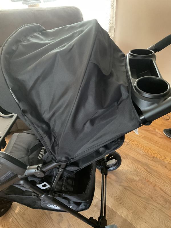 Canopy keeps sun and rain off and tray for grownups use too