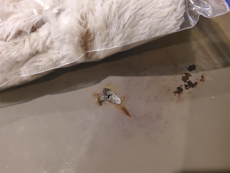 The silicone mat from inside the microwave. The hole is smaller than thhe damage to the sole, but for how hot it must have heated up so quickly, I am concerned.