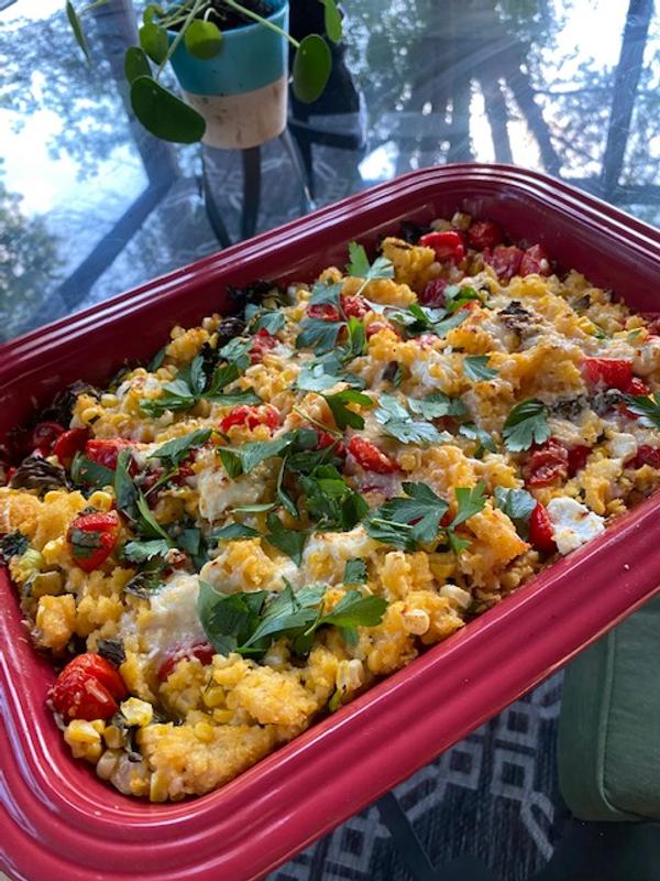 Creamy corn and polenta bake with lots of herbs