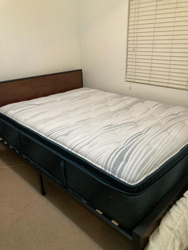 Mattress on the frame to give you an idea of what it looks like on a platform. Made my old bed look like a wimp lol