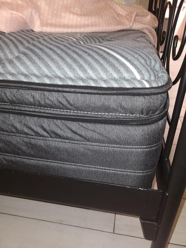 Showing the thickness of the mattress.