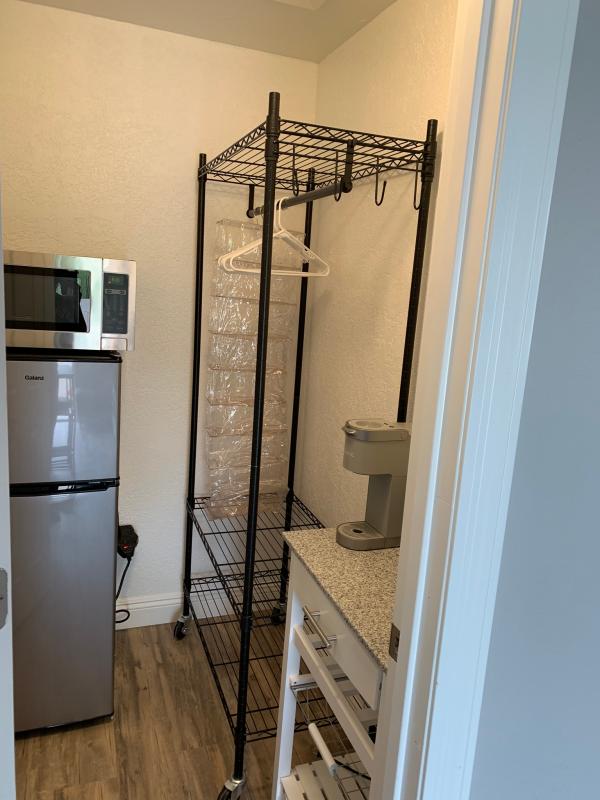 Oceanstar Garment Rack with Adjustable Shelves and Hooks in Black Bed