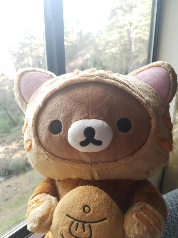 Rilakkuma™ Bear Dressed as a Tiger with Fish Plush Toy in Brown Bed