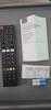 In the box. Remote, booklet and codes., click to load a larger version