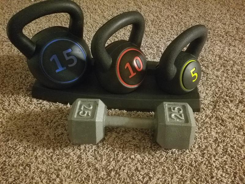 Weights in rack, sized with a 25lb dumbell