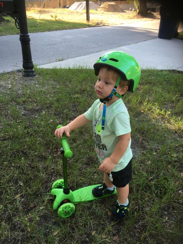 My 2 year old grandson Hopped on the scooter and away he went