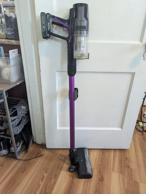 Vacuum standing up against a door