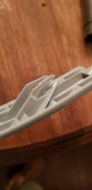 Broken catch which is part of the molded handle.