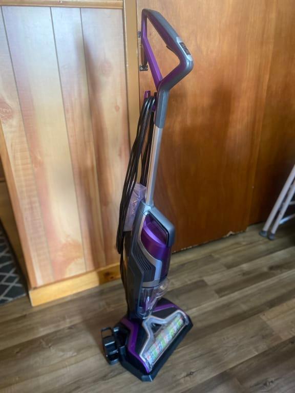 My Bissell sitting on its cleaning tray after being used.