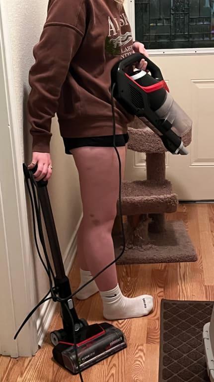 Using the handheld vacuum and having to lug around the entire vacuum.