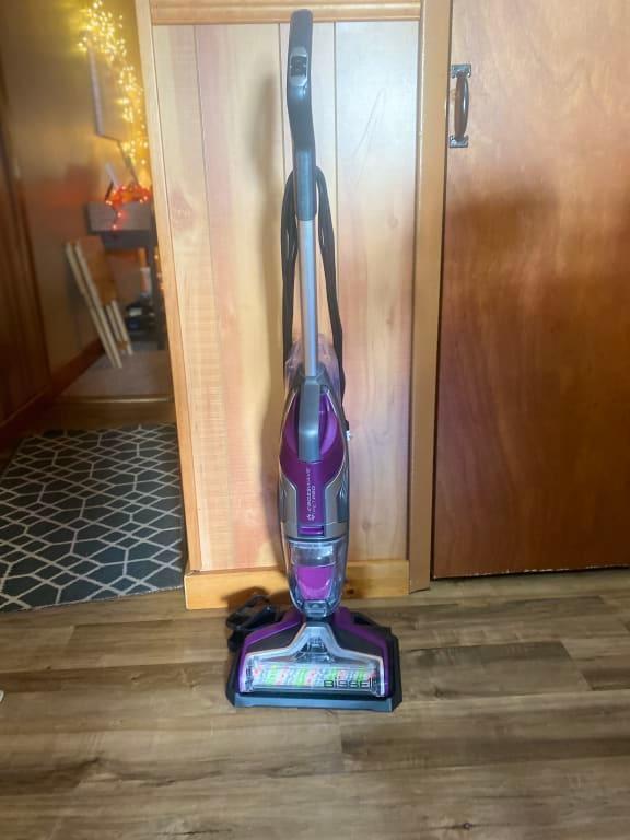 Slim and not heavy. It reaches under small spaces.
