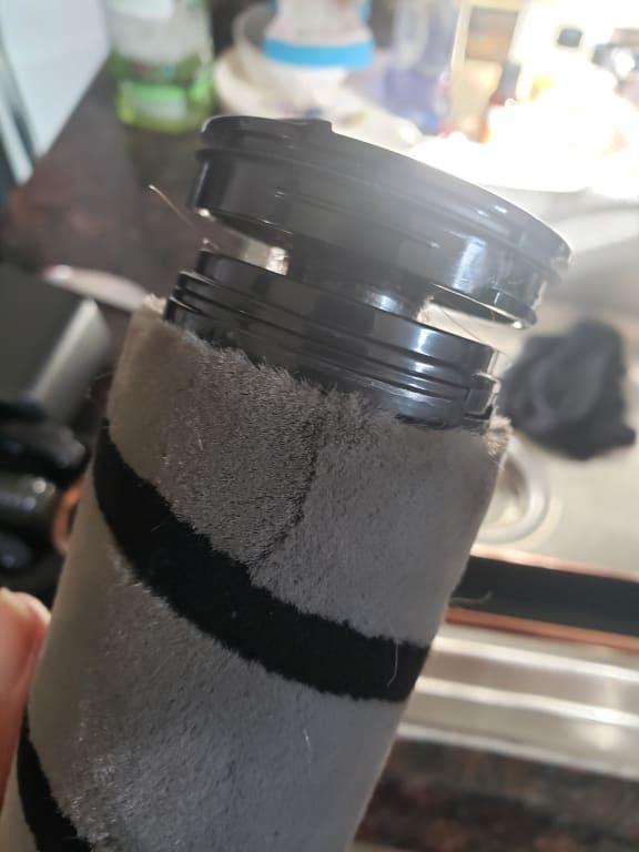 Hair rolled up in between roll and locking mechanism.