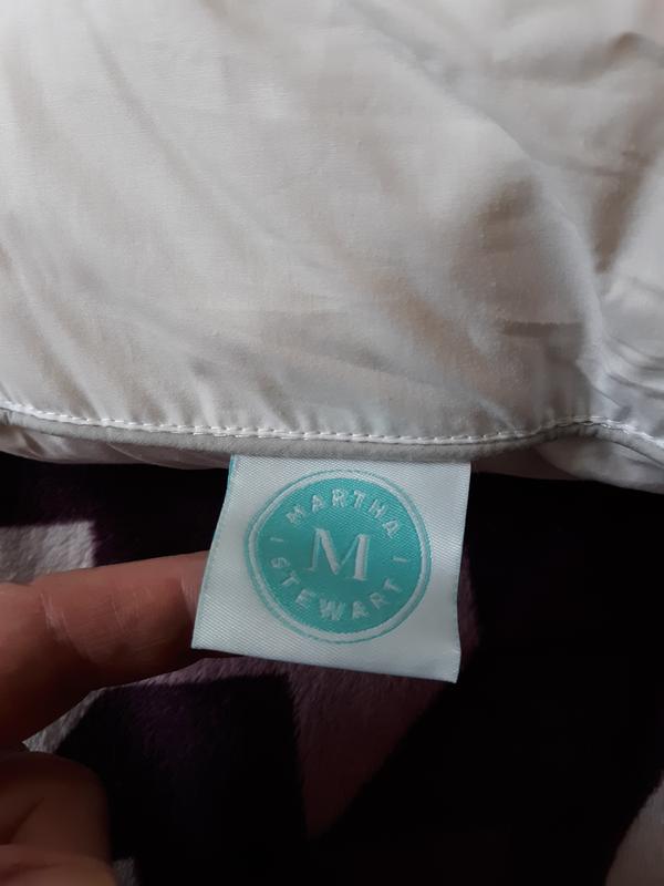 Here is the label that says Martha Stewart on her white feather or the down pillow