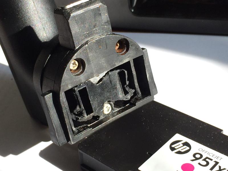 View of inside of handle, where plastic has broken down - 4 screw sockets that were holding the basket are broken off