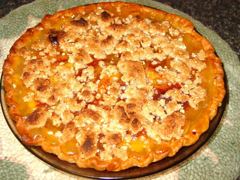 A 9" Peach Crumb Pie made in a glass pyrex dish, and My 8 slice Toaster Oven itself.