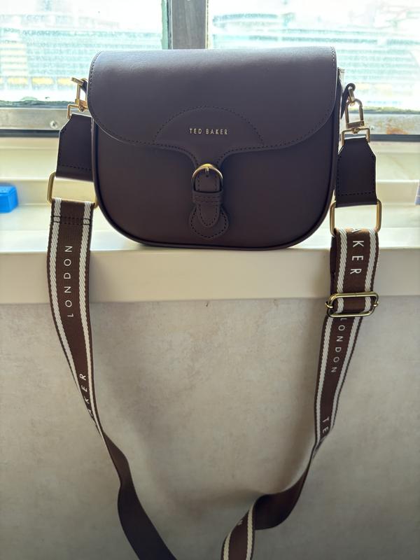 Ted Baker ESIA レザーウェビングクロスボディサドルバッグ Ted Baker- ESIA- Webbing Saddle Patent Leather Crossbody Bag