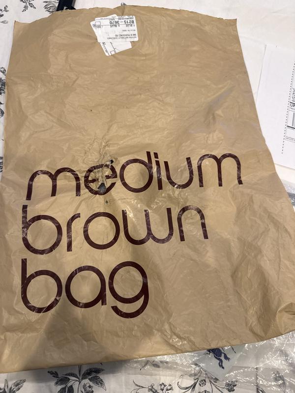 Hole in bag. No protection for scarf inside.