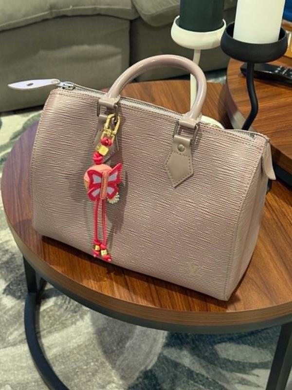 With a classic LV 25 Speedy Lilac