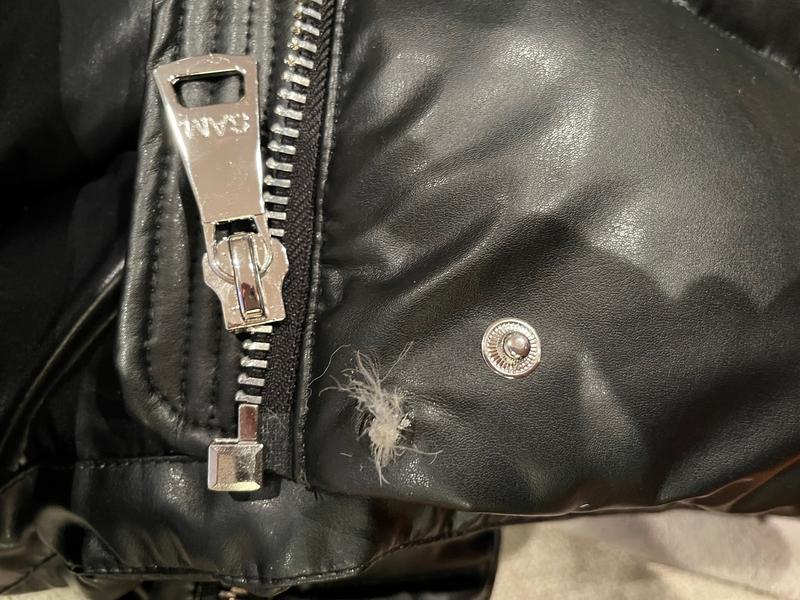 Broken snap leaking down feathers