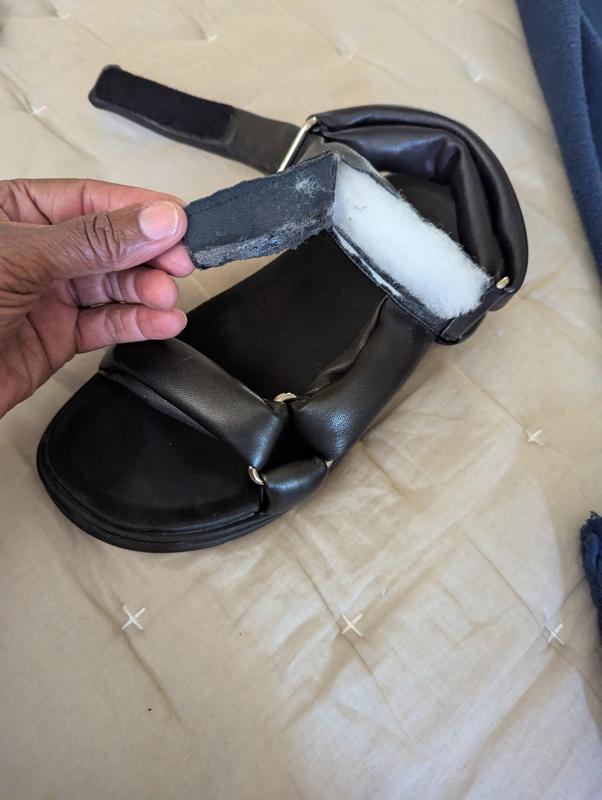 Was taking them off and the strap ripped open.