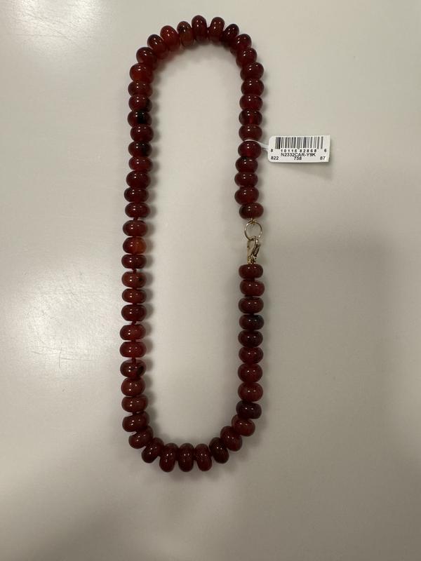 Sadly the color is not as rich as on website. It is carnelian. More arrange than cherry or cinnamon red.
Also the wire wrapped hooks do not match the clasp.