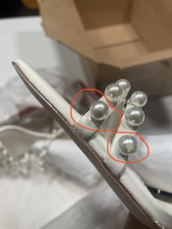 Scratched pearls on one of the shoes, I didn't even attempt to check the other shoe.