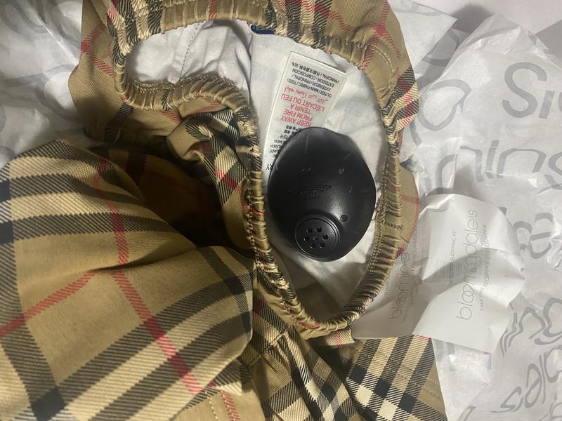 It was delivered with the alarm still attached to the dress.