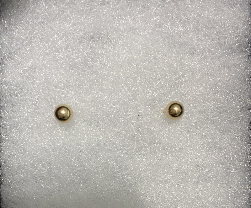 Solid gold ball studs.