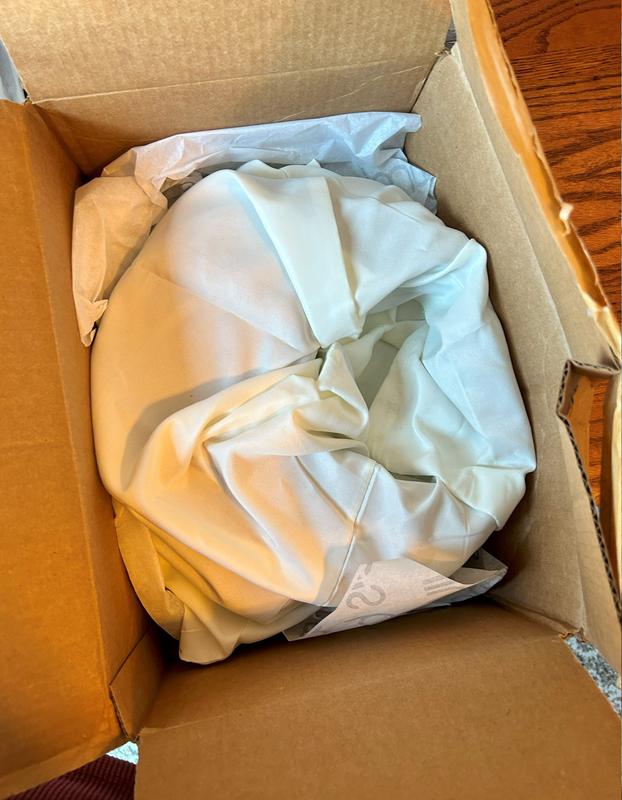 Item stuffed into too small box.